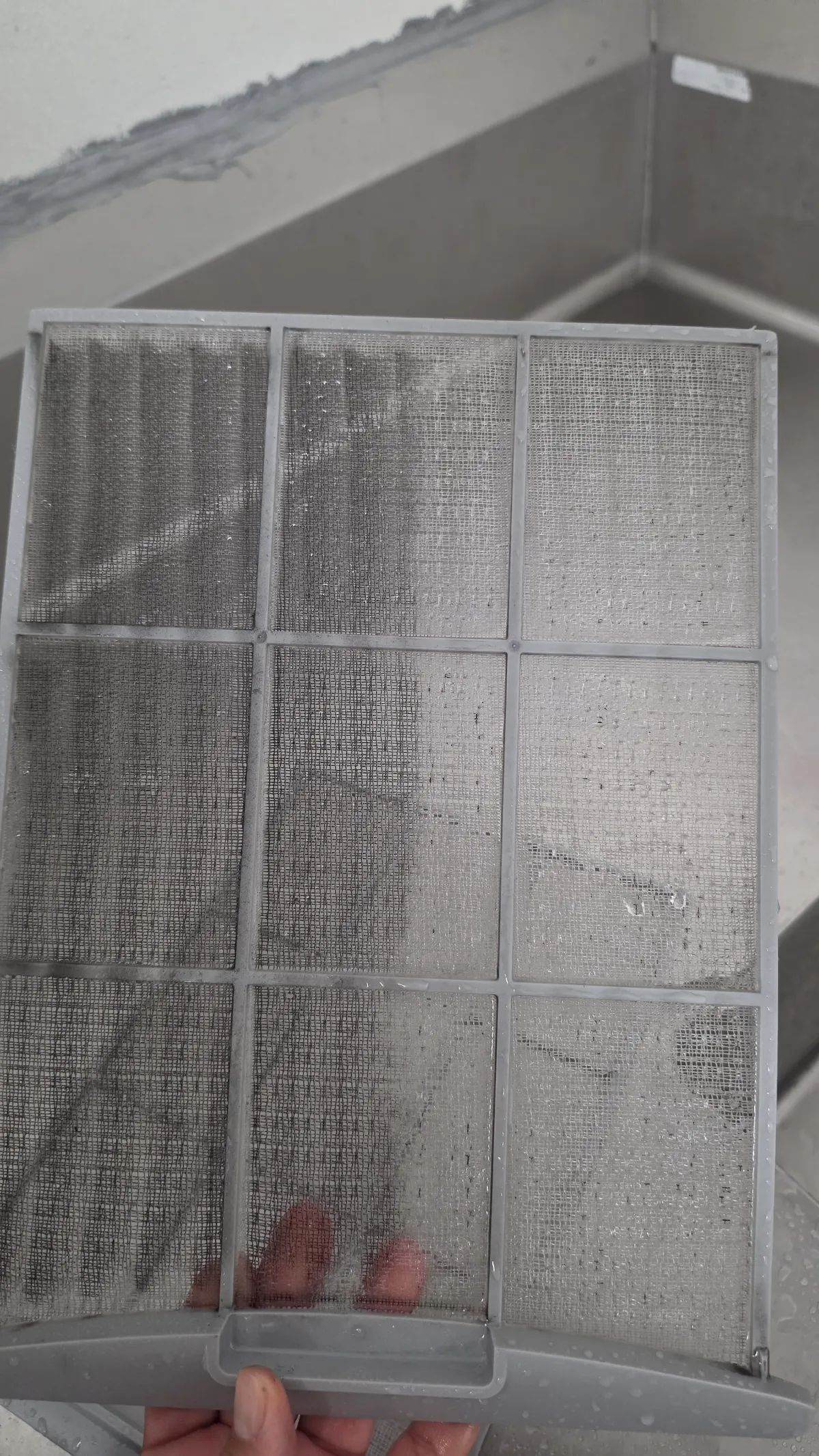 Progress photo showing cleaning filter during Commercial HVAC maintenance in Palm Springs, California