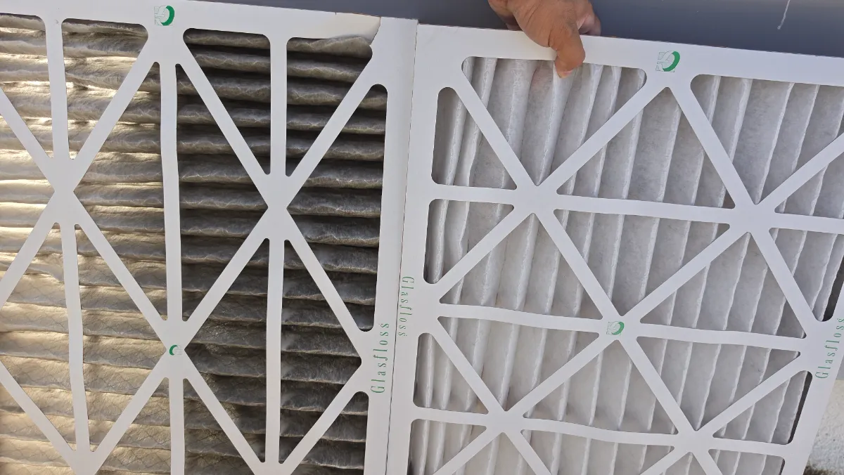 Progress photo showing Dirty vs clean fikter during Commercial HVAC maintenance in Palm Springs, California