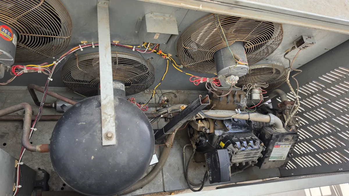 Progress photo showing opened condensing unit during Commercial Refrigeration repair in Coachella, California