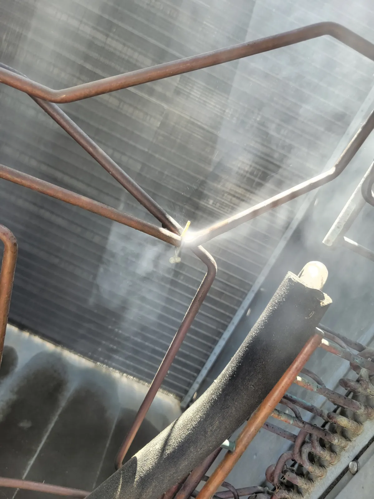 Progress photo showing Leak refrigerant coming out during Commercial HVAC service in Cathedral City, California