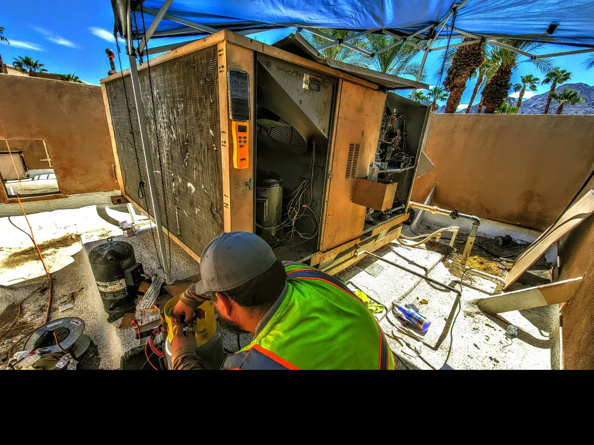 Progress photo showing AC heat pump repair during Commercial HVAC service in La Quinta, California