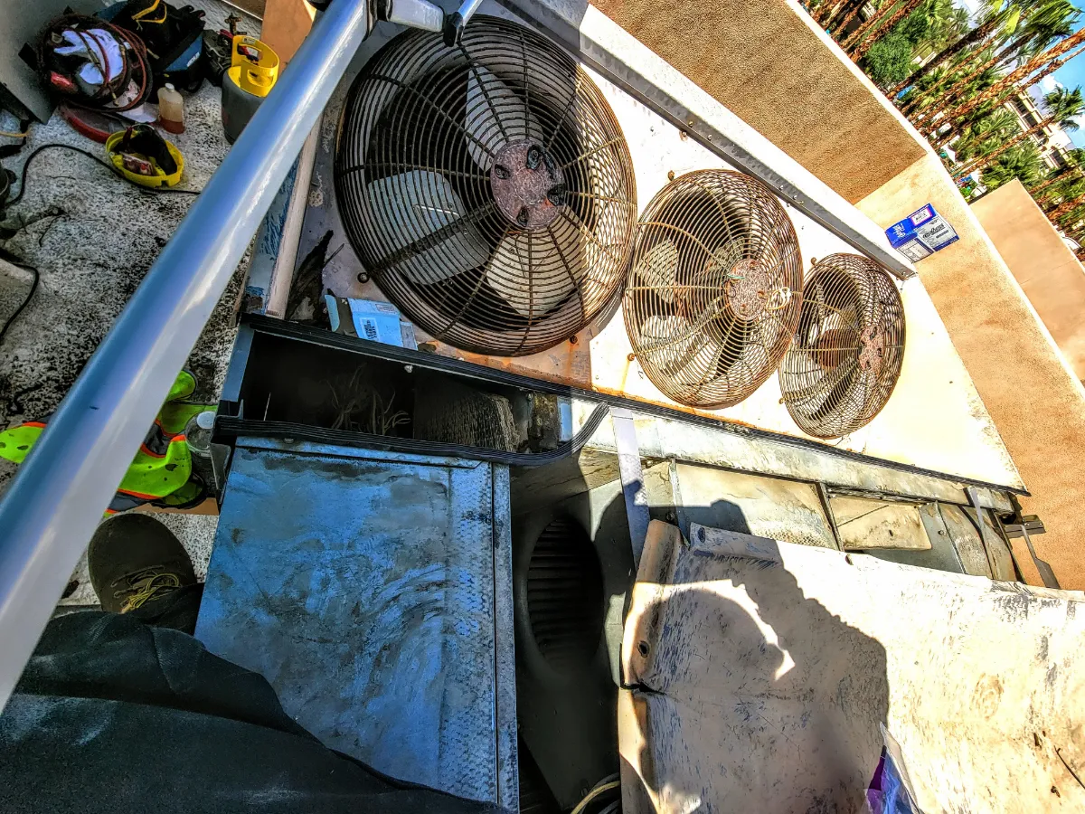 Progress photo showing condensing unit fans during Commercial HVAC service in La Quinta, California