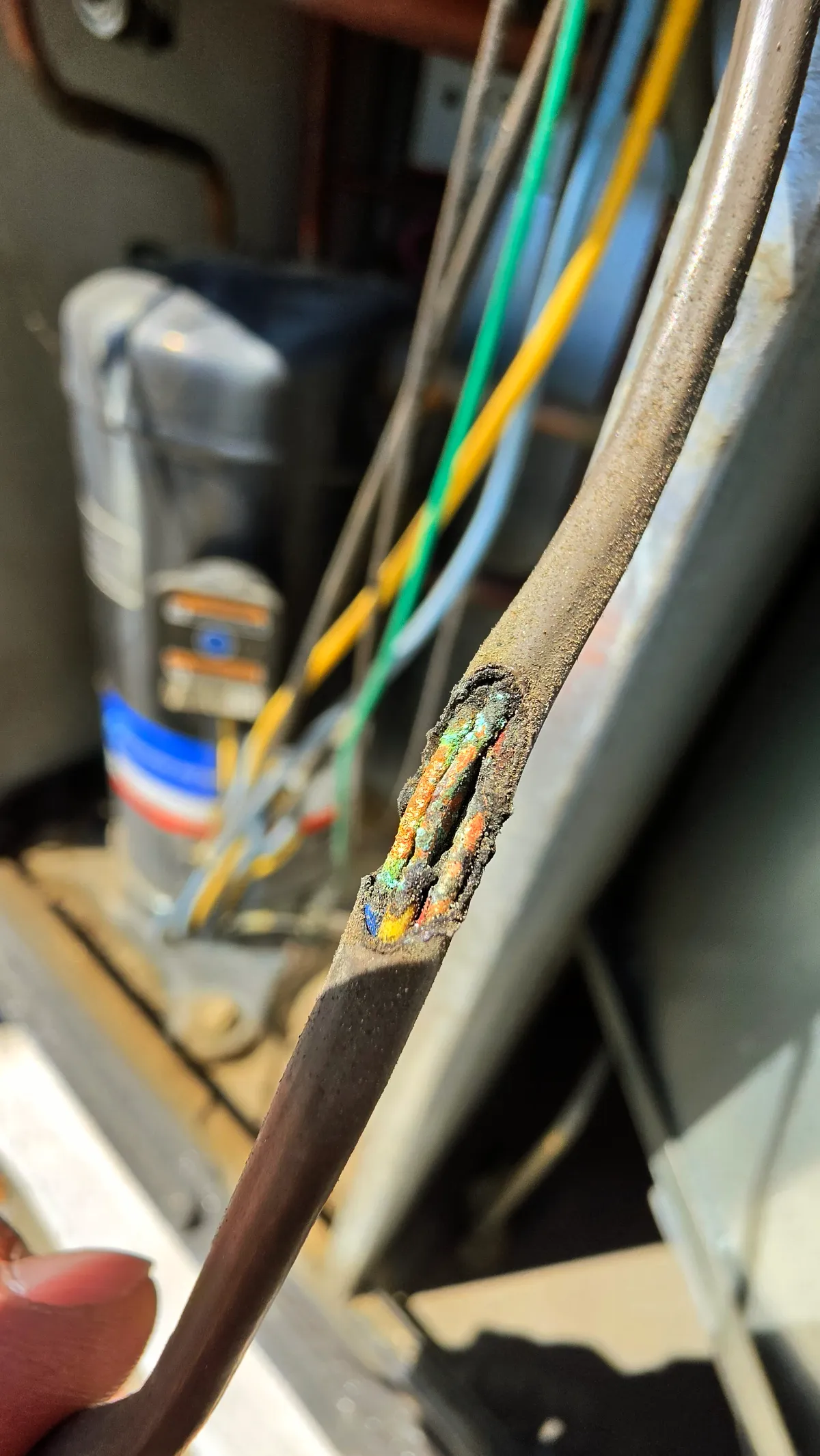 Progress photo showing shorted wires during Commercial HVAC repair in Rancho Mirage, California