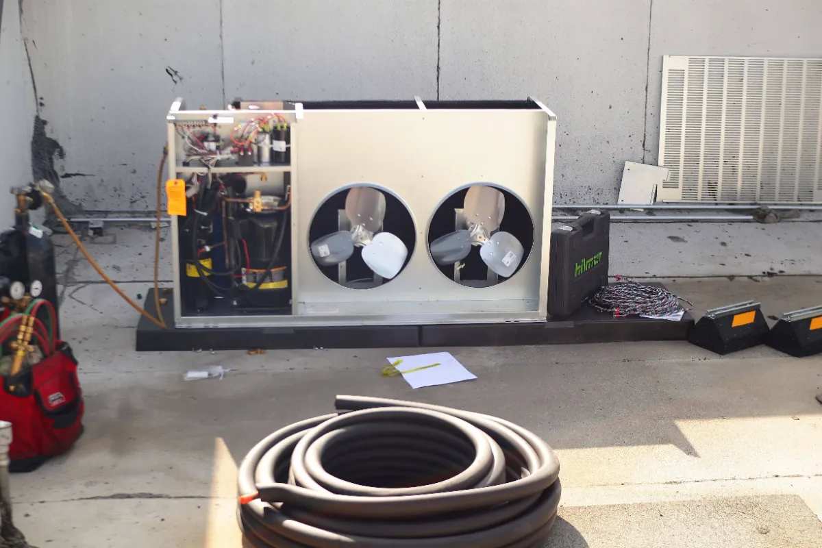 Progress photo showing setting up condensing unit during Commercial Refrigeration installation in Palm Desert, California