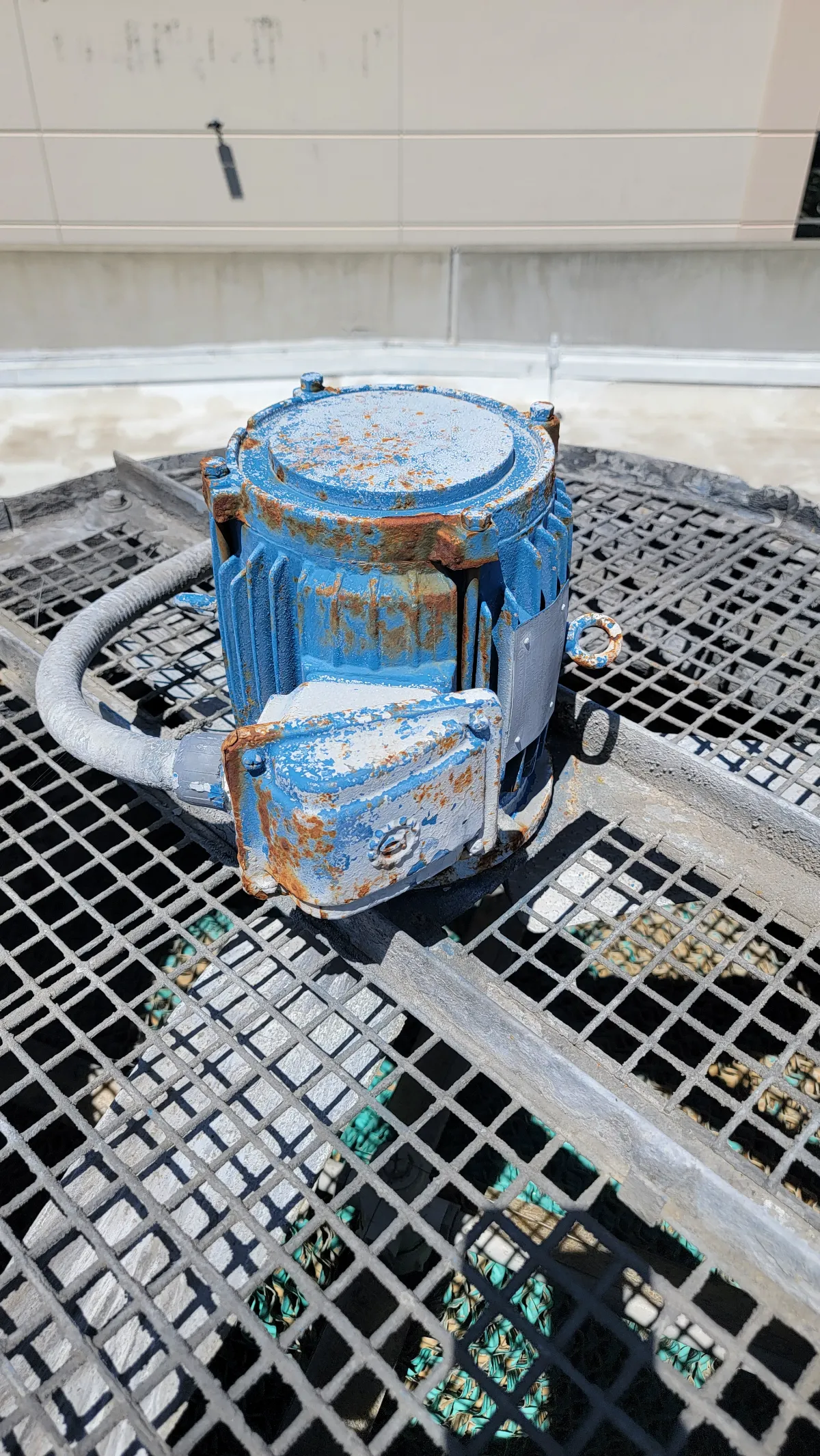 Progress photo showing cooling tower motor during Commercial HVAC maintenance in Palm Desert, California