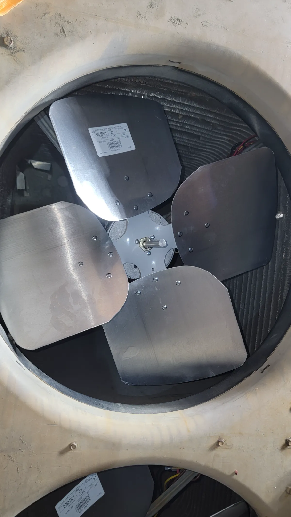 Progress photo showing new condenser motor during Commercial HVAC service in Palm Desert, California