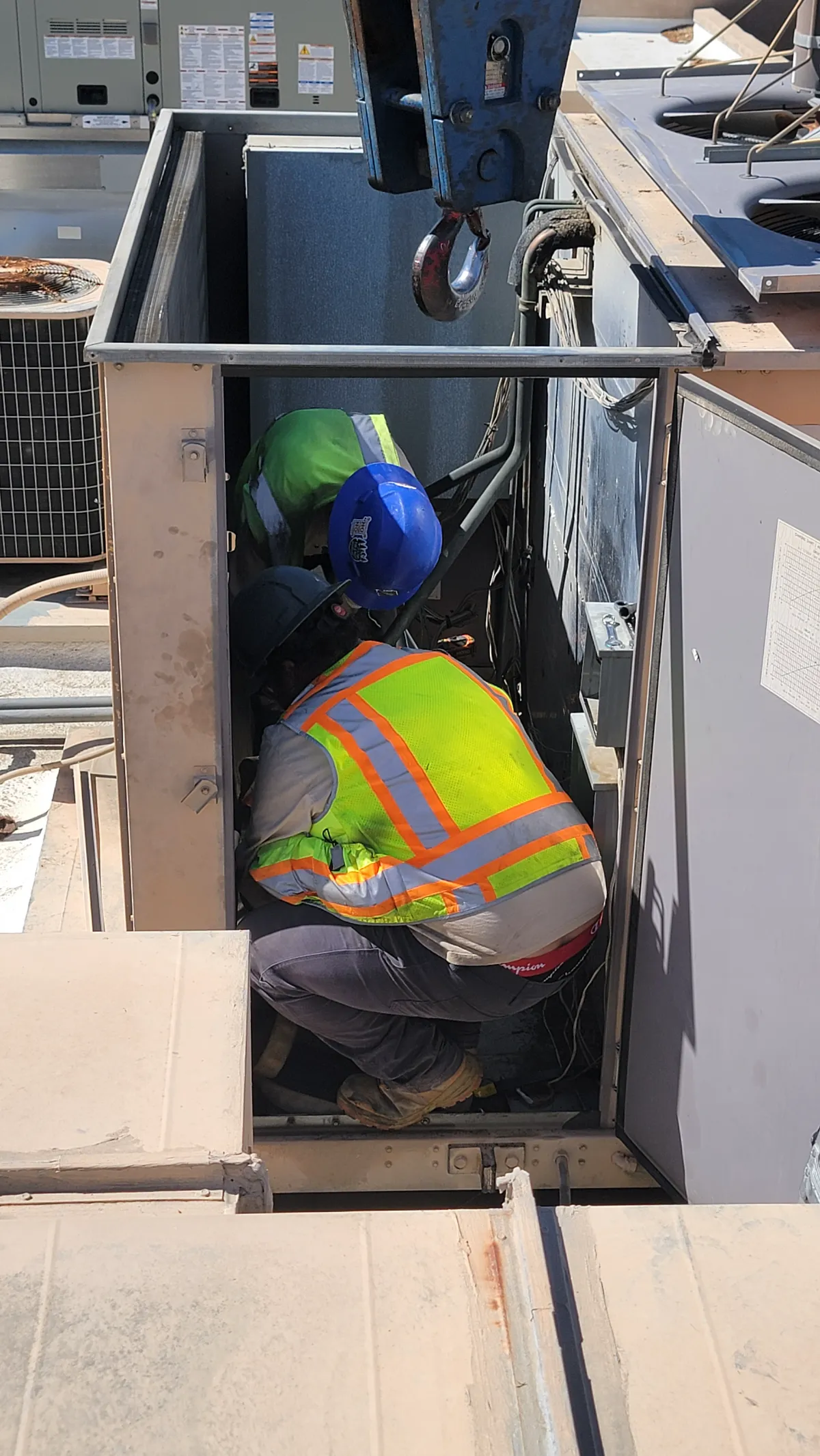 Progress photo showing installing compressors during Commercial HVAC repair in Indian Wells, California
