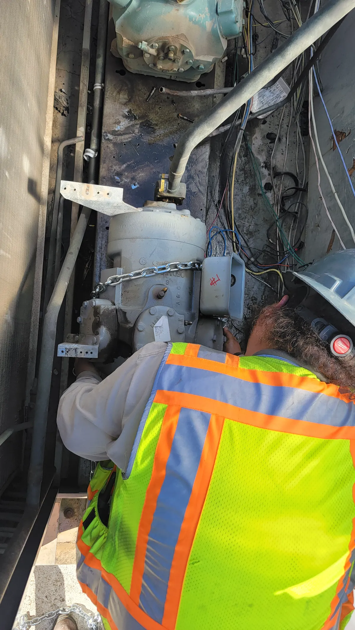 Progress photo showing removing old compressor during Commercial HVAC repair in Indian Wells, California