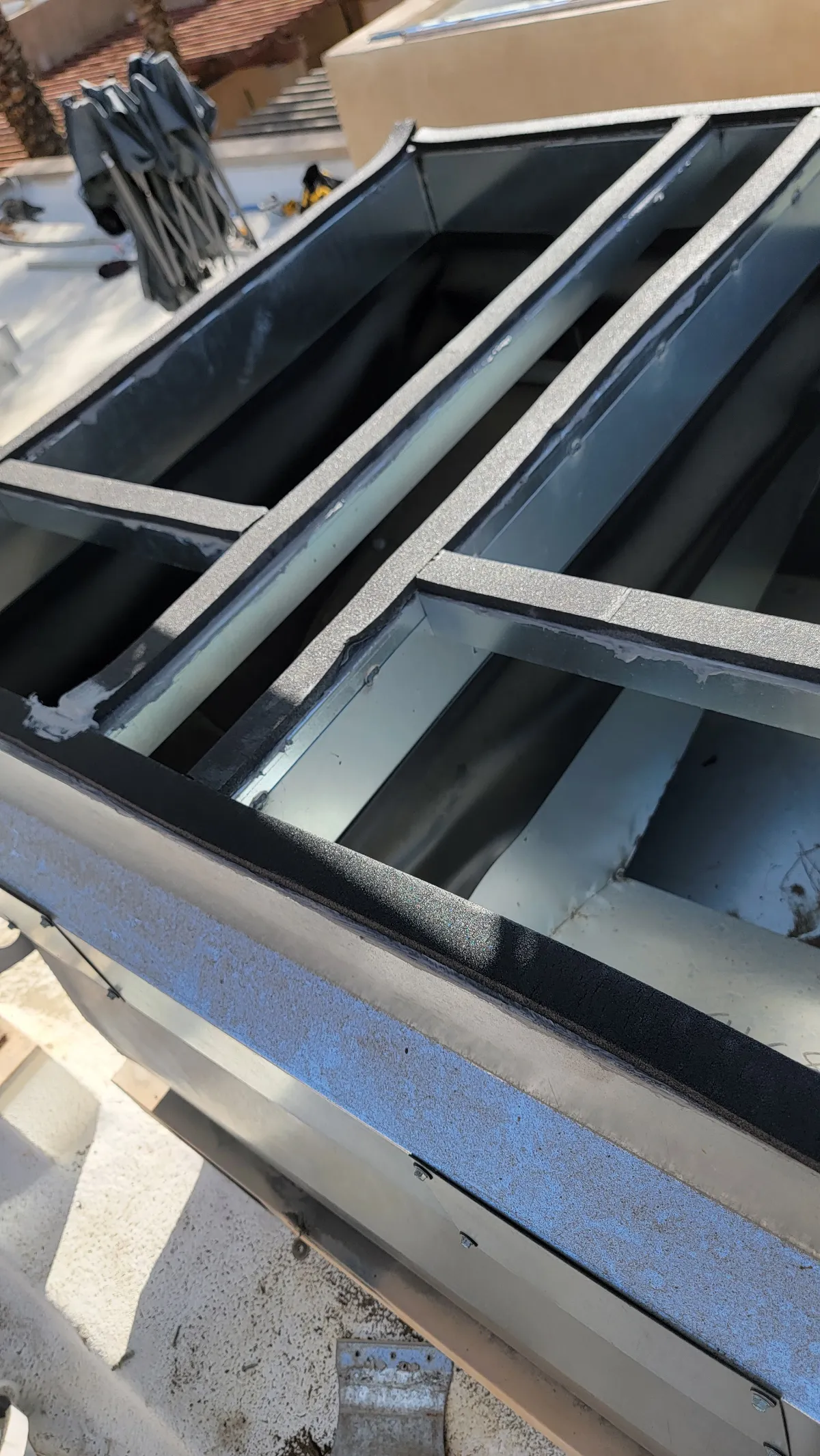 Progress photo showing curb adaptors during Commercial HVAC installation in Indian Wells, California